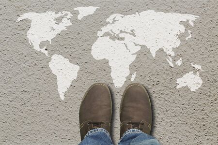 Grey fashion shoes on world map backgroundの写真素材