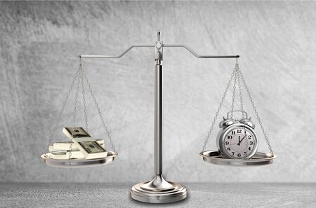 Justice Scales with money and alarm clock. Justice conceptの写真素材