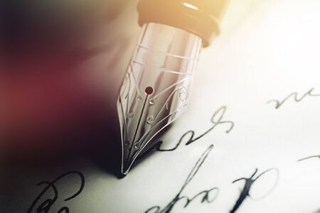 Fountain pen on  handwritten on backgroundの写真素材