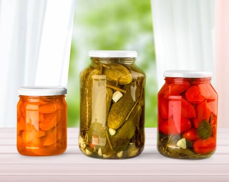 Home Canning Jars of Summer Harvest Vegetable on White Backgrounの写真素材