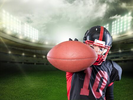 American football player against pitch backgroundの写真素材