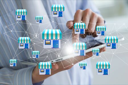Businessman showing Franchise system on a mobile device.の写真素材