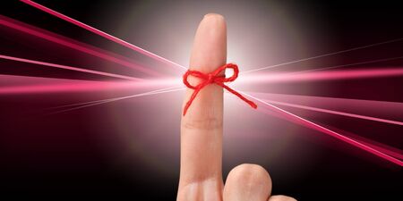 Rope bow on finger pointing  up on background
