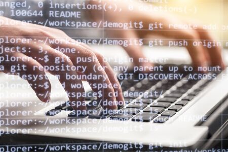 Business and modern technology, double exposure, man programmer coding on laptop computer and smart...