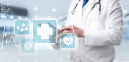 Medicine doctor and stethoscope using tablet with icon medical network connection on virtual screen interface in hospital background. Modern medical technology concept.の写真素材