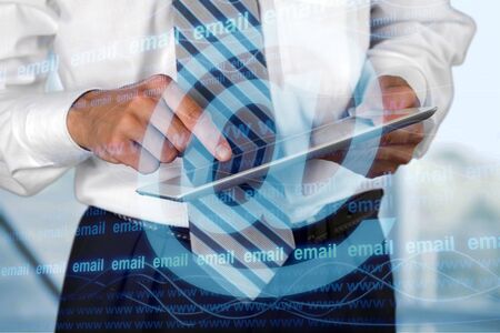 Businessman tapped on digital tablen on blurred background