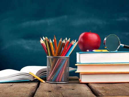 Stationery objects in mini supermarket cart on  backgroundの写真素材