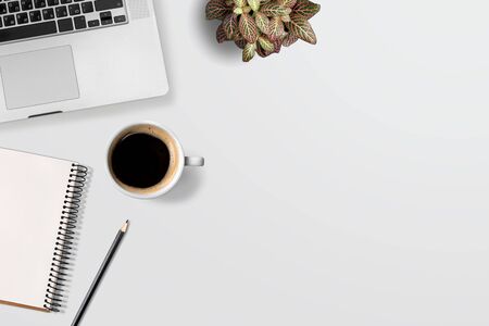Businessman's workplace clean Desk with laptop and Cup of coffee top view