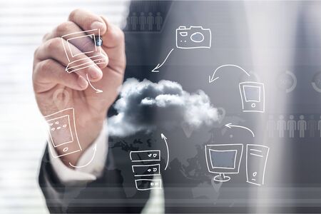Young businessman showing hand drawn cloud computing