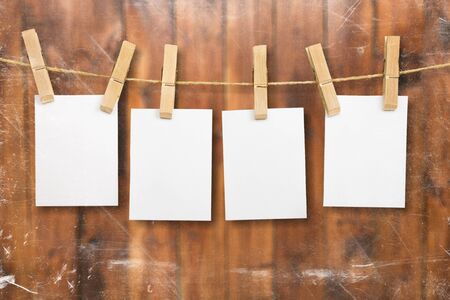 Collection of various notes and a clothes pegs on white background with clipping path