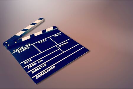 Clap board on wooden backgroundの写真素材