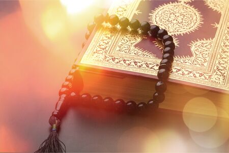 Islamic Holy Quran and Subha on Soft Light Background