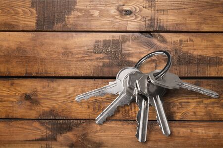 House metal keys on wooden desk