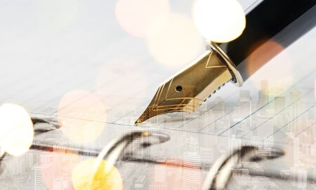 Fountain pen on  handwritten on backgroundの写真素材