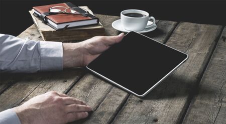 woman shows screen of digital tablet in his hands. Clipping path included.の写真素材