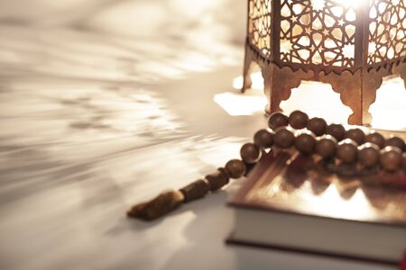 Ornamental Arabic lantern with burning candle glowingの写真素材