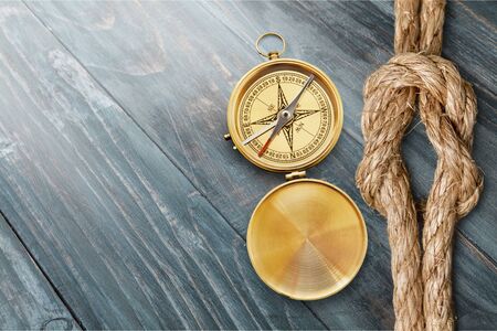 Brass antique compass on desk