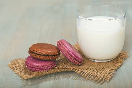 Very sweet retro bottle of milk with cookie on old tableの写真素材