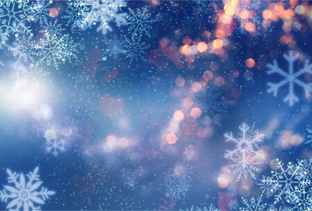 Abstract blue and white christmas background with snowflakes, snow fall and bokeh. Abstract chrismas backgroundの写真素材