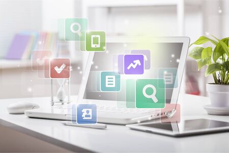 Businessman pressing application button on computer with touch screenの写真素材