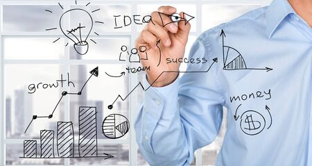 Businessman drawing different stagesの写真素材