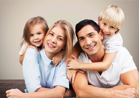 Beautiful smiling Lovely family on backgroundの写真素材