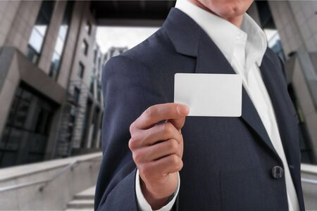 Businessman showing his business cardの写真素材