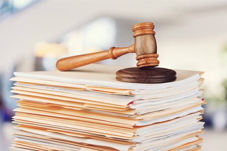 Judge hammer and documents on  backgroundの写真素材