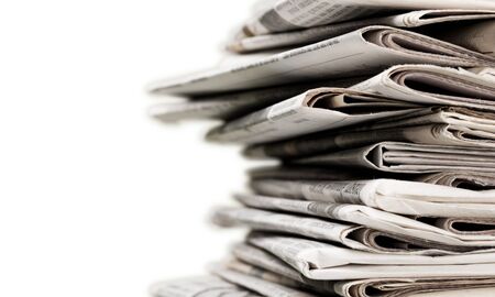 Pile of newspapers on white background