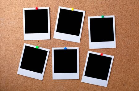 Blank photographs on a bulletin boardの写真素材
