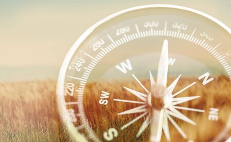 Brass antique compass  on backgroundの写真素材