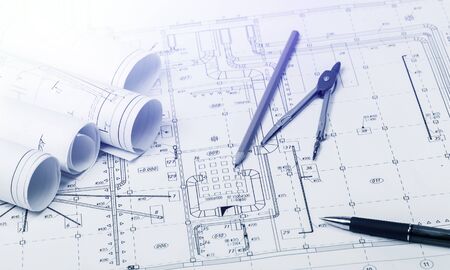 The part of architectural project and pencil, pen with divider on tableの写真素材