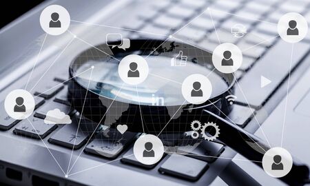 Keyboard with black magnifier glass and social illustration