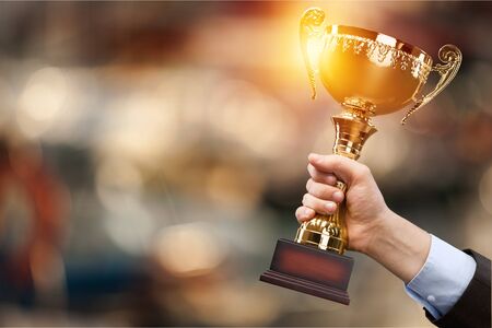 Champion golden trophy for winner background. Success and achievement concept. Sport and cup award...