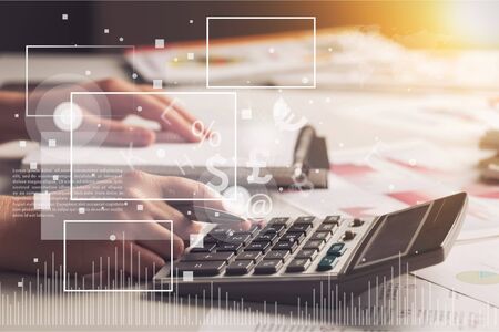 Woman using a calculatorの写真素材