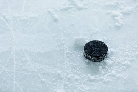 Hockey Puck on Ice Rinkの写真素材