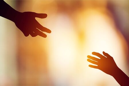 Help hand on sunset background
