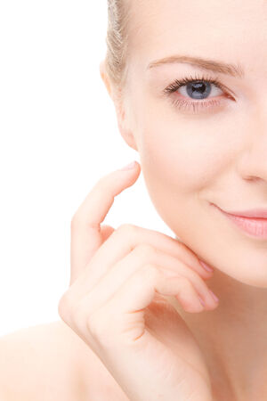 Young beauty woman portrait.Half head.  Girl Touching her Face. Studio shot. Isolate on white. Health Care, cosmetic concept. Blank for commercial advertisingの写真素材