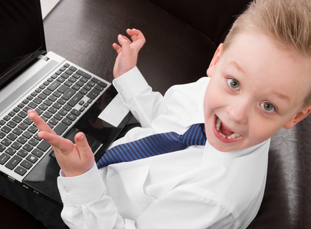 Young Businessman boy confused in suit looking at the cameraの写真素材