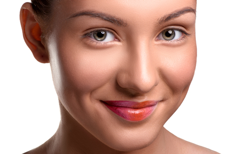 Close up head shot of beautiful young woman with colorful lips makeup on isolated white background looking at the cameraの写真素材