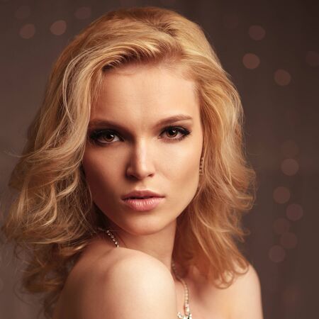 Luxury woman posing. Head shot on bokeh backgroundの写真素材