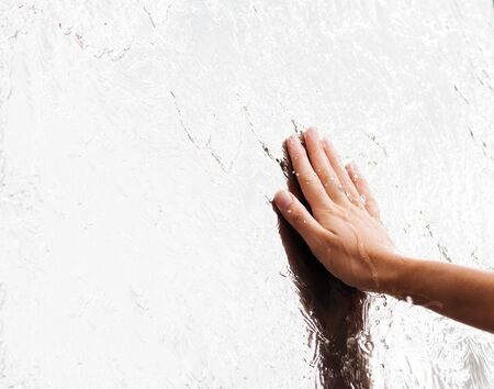Finger touches water close up. abstract shotの写真素材