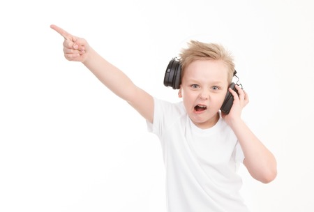 Boy in headphones thinking. Isolated on whiteの写真素材