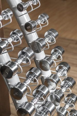 Dumbbells on a stand in the gym.の写真素材