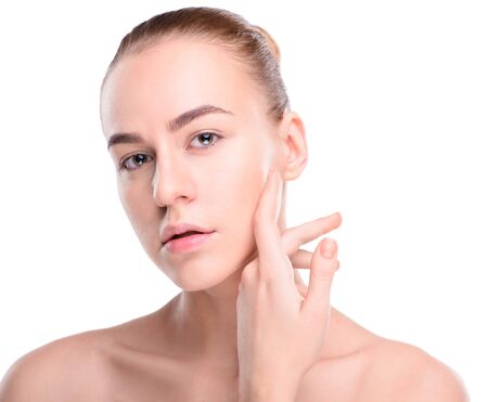 Beauty of health young woman. Girl Touching her Face. Isolate on white backgroundの写真素材