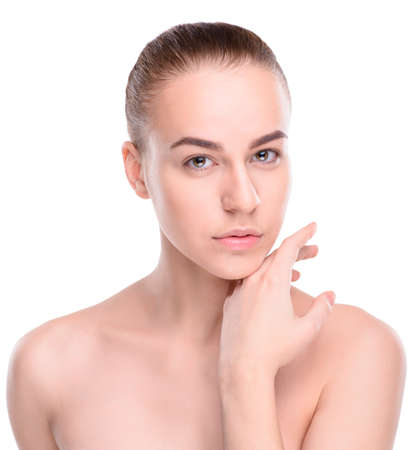 Beauty of health young woman. Girl Touching her Face. Isolate on white backgroundの写真素材