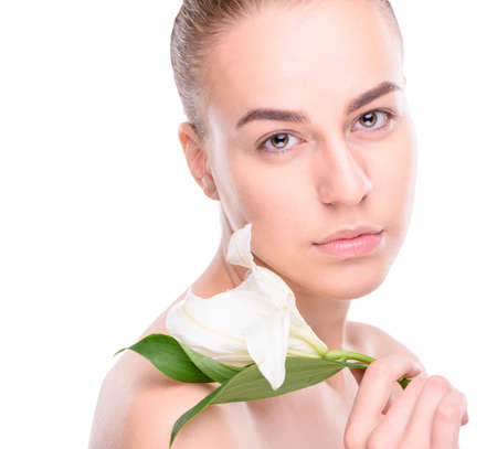 Beauty of health young woman with lily. Isolate on white backgroundの写真素材