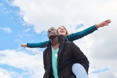 Portrait Of Loving Youg International Couple. African Guy and Caucasian Woman.の写真素材