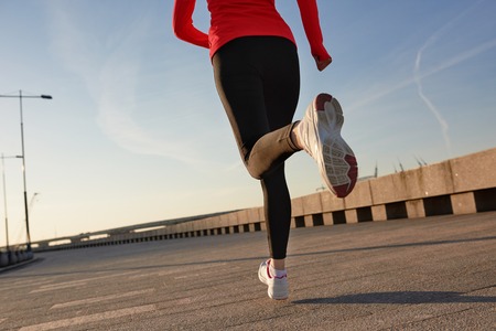 Close up shot of running woman. Selective focus.の写真素材