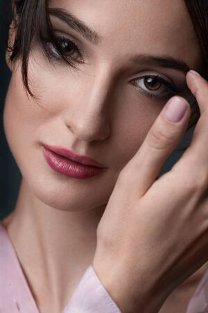 Close up portrait of young smiling woman. Red lipsの写真素材